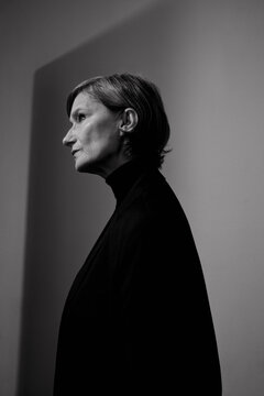 Studio portrait of a woman in a black jacket