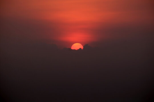 Sunset With The Calm Red Sun