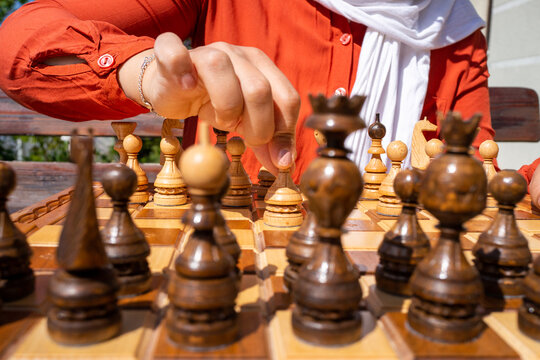 Muslim Woman Playing Chess