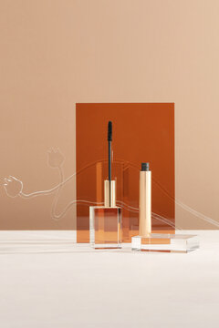Mascara for eyelashes on beige background. Makeup product