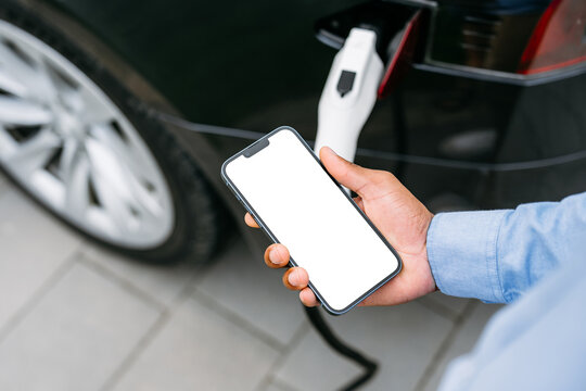 A mobile phone with a white screen in men's hands