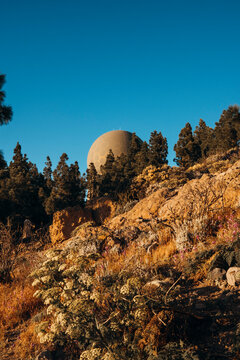Astronomical observatory on the top of a mountain