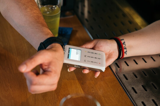 Tap to pay smart watch payment transaction/purchase at bar