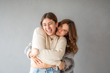 Young female couple hugging