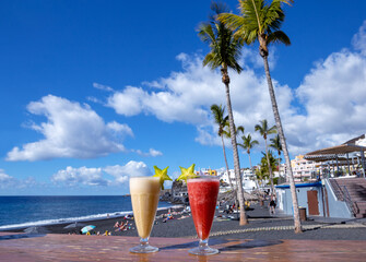 Two smoothies on the table at the beach bar, Puerto Naos, Island La Palma, Canary Islands, Spain, Europe.