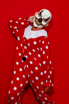 clown wearing a red costume posing