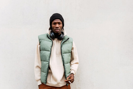 Black man smoking on street