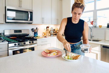 woman preparing avocado toast