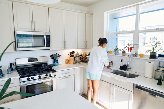 cleaning kitchen after breakfast