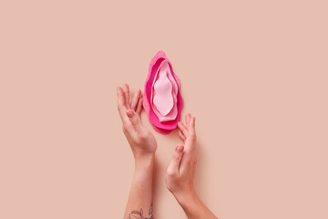 Woman's hands touching vulva made of polyurethane texture materials