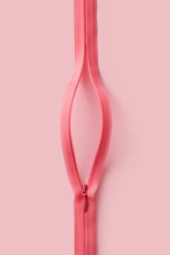 Pink zipper fastener representing structure of female vagina
