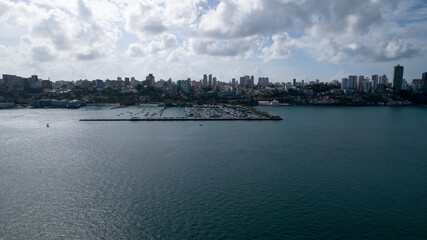 Fototapeta premium Nautical garage and pier with sea ​​barrier all around. Boats anchored at the pier