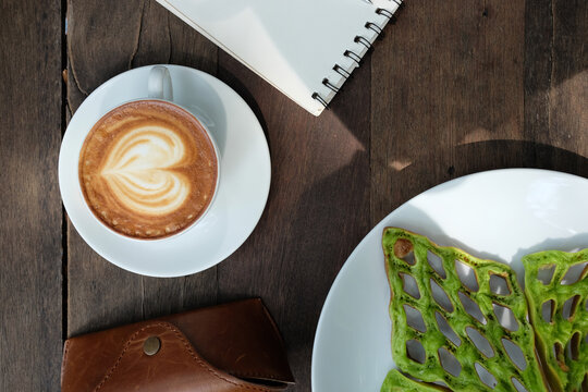 Top view of latte cup on the table 