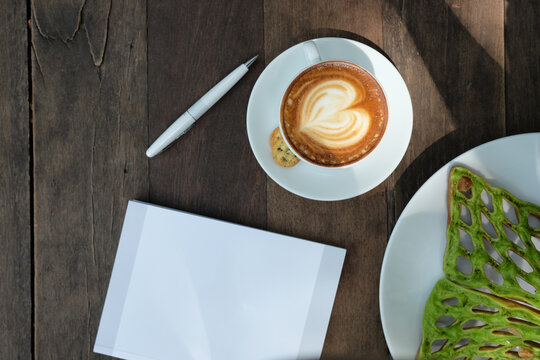 Top view of latte cup on the table 