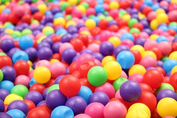 Fototapeta na wymiar Many colorful balls as background, closeup. Kid's playroom