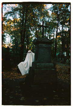 Cute ghost posing at the cemetery
