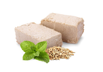 Tasty halva, peeled sunflower seeds and mint leaves isolated on white
