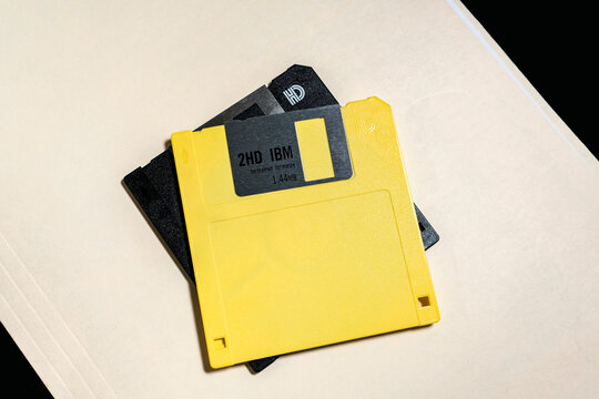 Old 3 and a half inch floppy disks on a manila folder