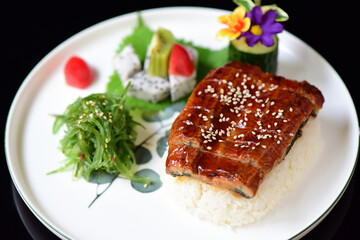 Delicious seafood and eel rice placed on a plate