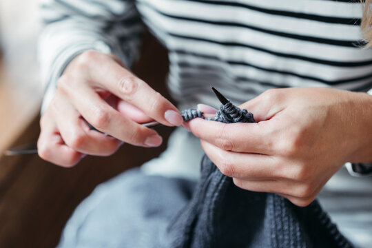 Hands of knitting woman.