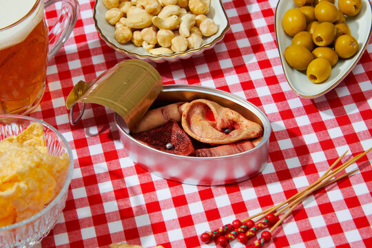 appetizers and tin can with some amputated human parts
