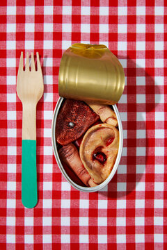 tin can with some amputated human parts on a table