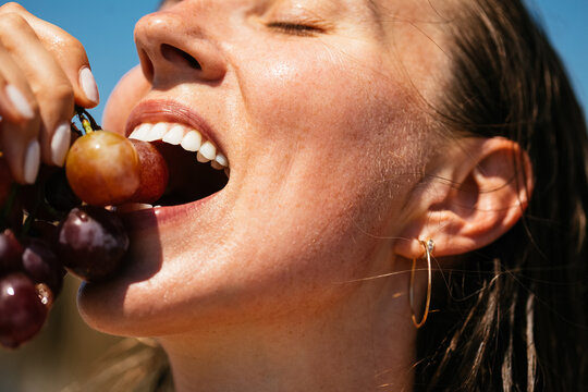 Woman Eating Grape