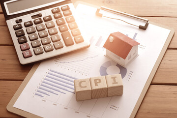 On the data chart, there are small houses, calculators, and the letters CPI