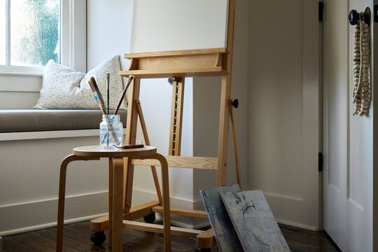 Tabula Rasa: Blank canvas on easel in home art studio