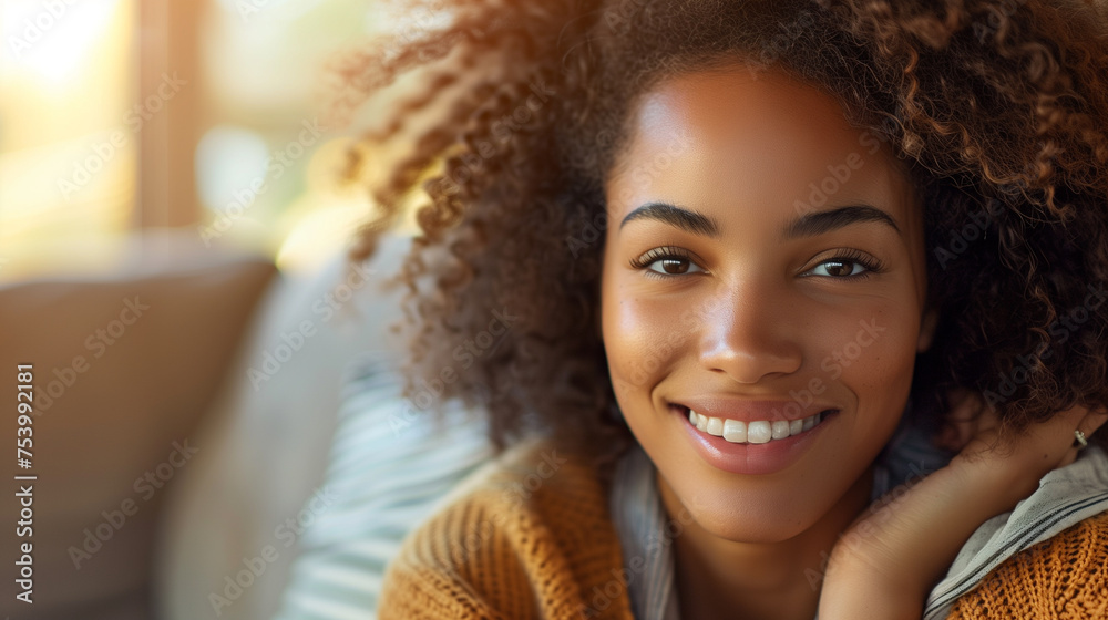 Wall mural warm, candid and natural portrait of a cute black young woman, composed with copy space.