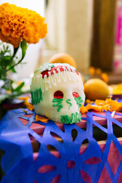 Sugar skull of an ofrenda .
