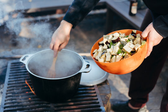 Male Preparing food outdoors.