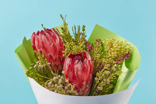 Beautiful bouquet with red proteas and various wild flowers