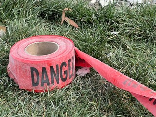 Red danger tape near a construction repair site - 753995176
