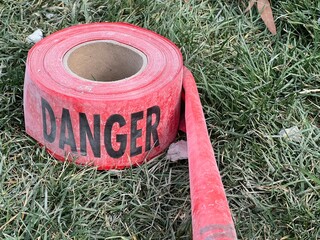 Red danger tape near a construction repair site - 753995181
