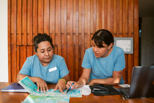 Women with maps in reception