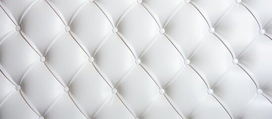This close-up shows the detailed texture of a white upholstered mattress, highlighting its softness and comfort. The clean, bright surface invites relaxation and rest.