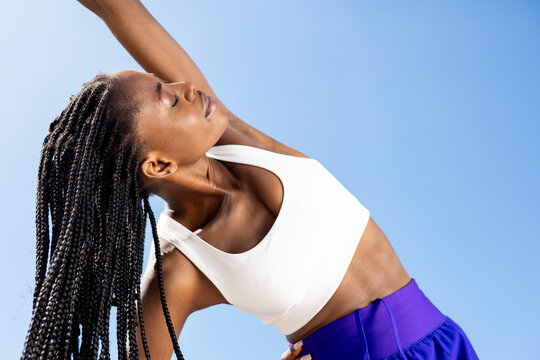 Morning Fitness with Athletic Woman and Blue Sky