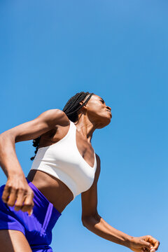 Morning Fitness with Athletic Woman and Blue Sky