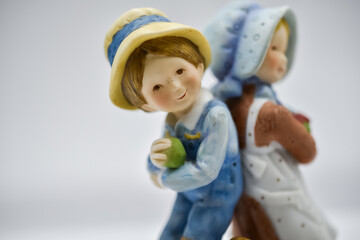 Porcelain figurine of boy and girl 