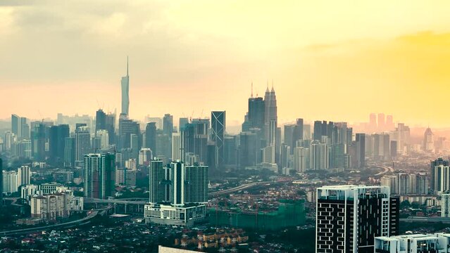 Kuala Lumpur, Malaysia. 15 February 2024. Kuala Lumpur City Scape 4k Aerial Footage during glowing sunrise.

