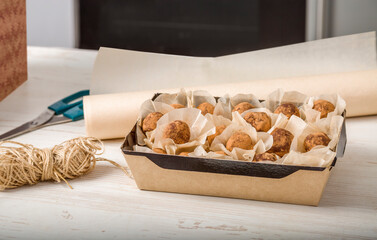 Homemade candies in eco-friendly packaging on the kitchen table. Preparation of an individual order. Small business