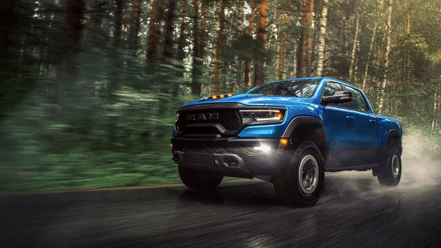  Novosibirsk, Russia - July 27, 2023:  blue  Dodge Ram Trx Havok Edition, pickup  driving   on the street on a warm day against the backdrop of a forest