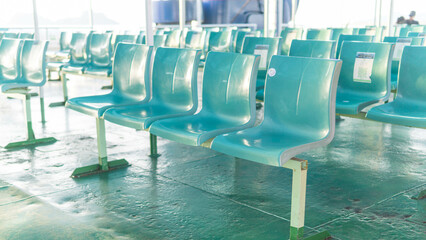 rows of empty passenger seats inside the ferry ship.
