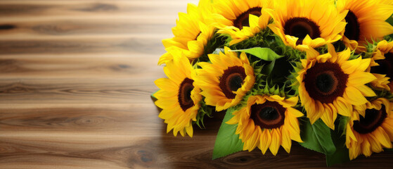 Beautiful Blooming yellow sunflower flower on a flat wooden table with empty space for text
