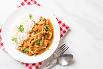 Japanese curry rice with sliced pork, carrot and onions