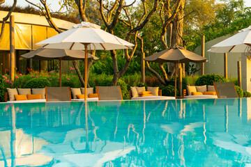 umbrella with bed pool around swimming pool with ocean sea background