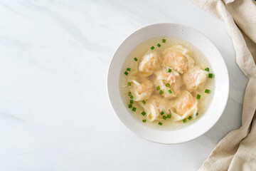 shrimp dumpling soup in white bowl