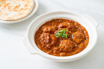 chicken tikka masala spicy curry meat food with roti or naan bread