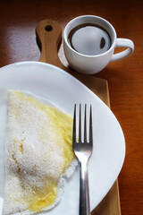 Traditional flatbread in Brazil called Tapioca with black coffee cup.